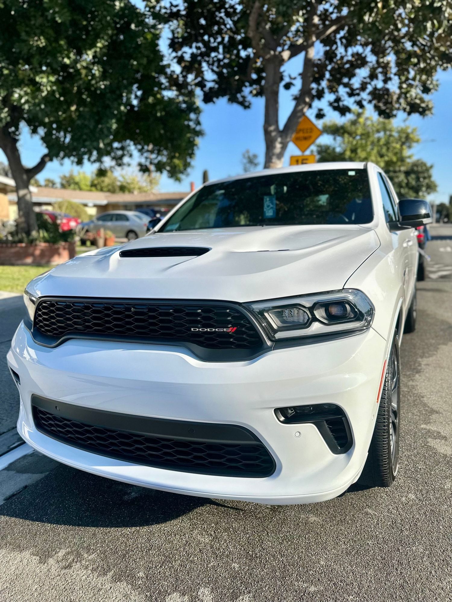 Front of a white Dodge Durango with clean, glossy paint and dark wheels